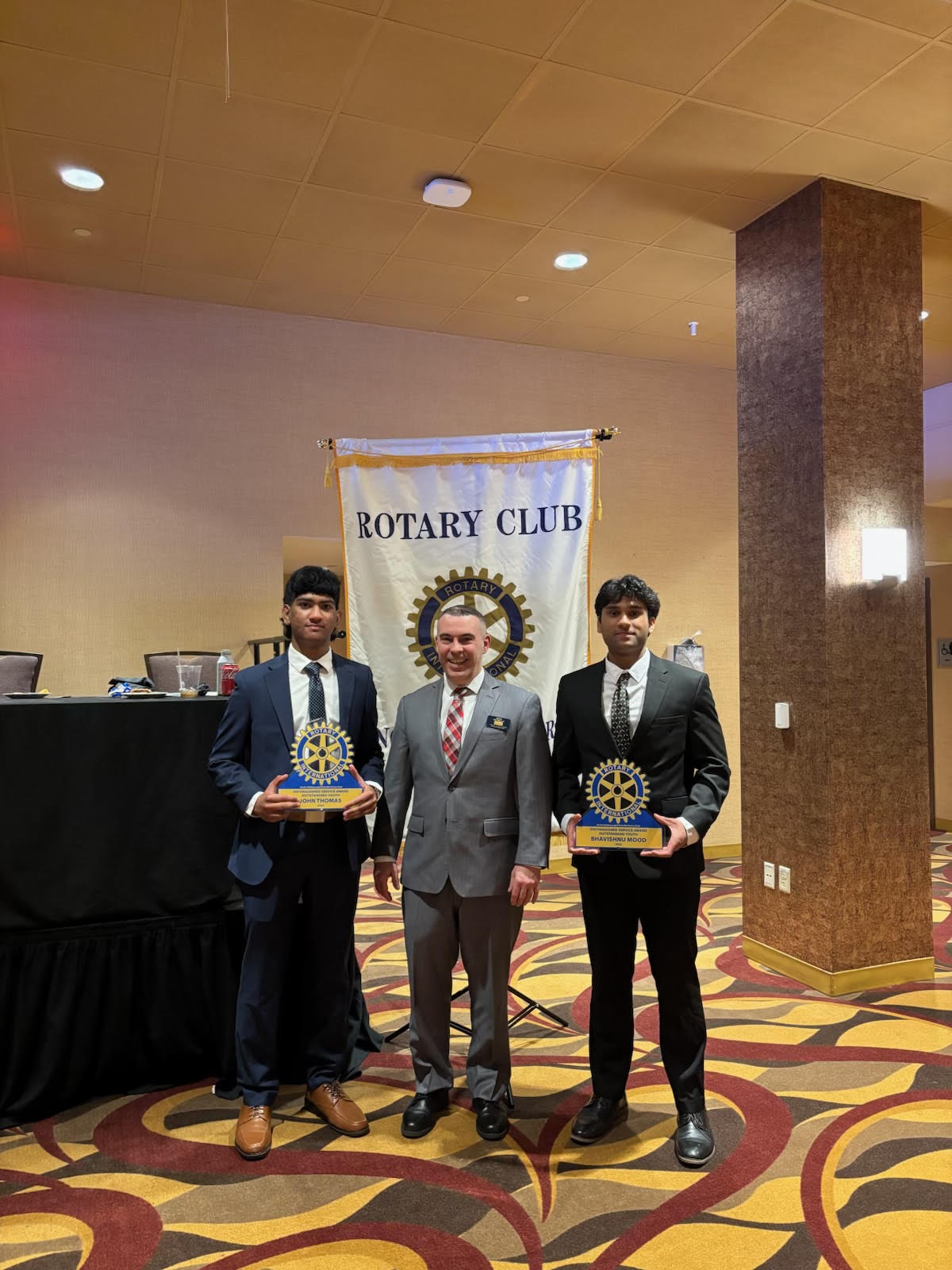 Bhavi Mood and John Thomas receiving Rotary Club Distinguished Service Awards