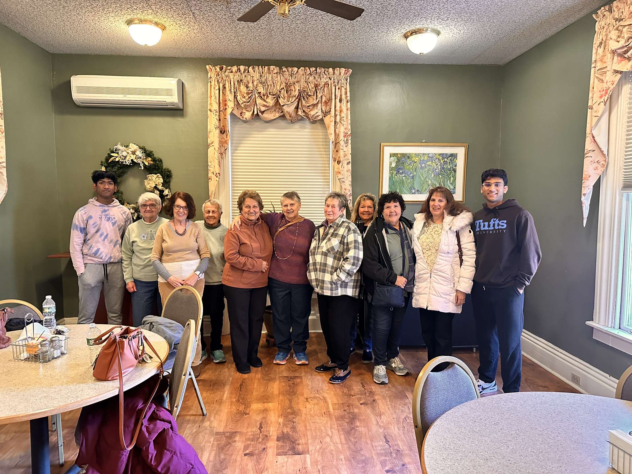 NASTP student volunteers with senior residents at a community center